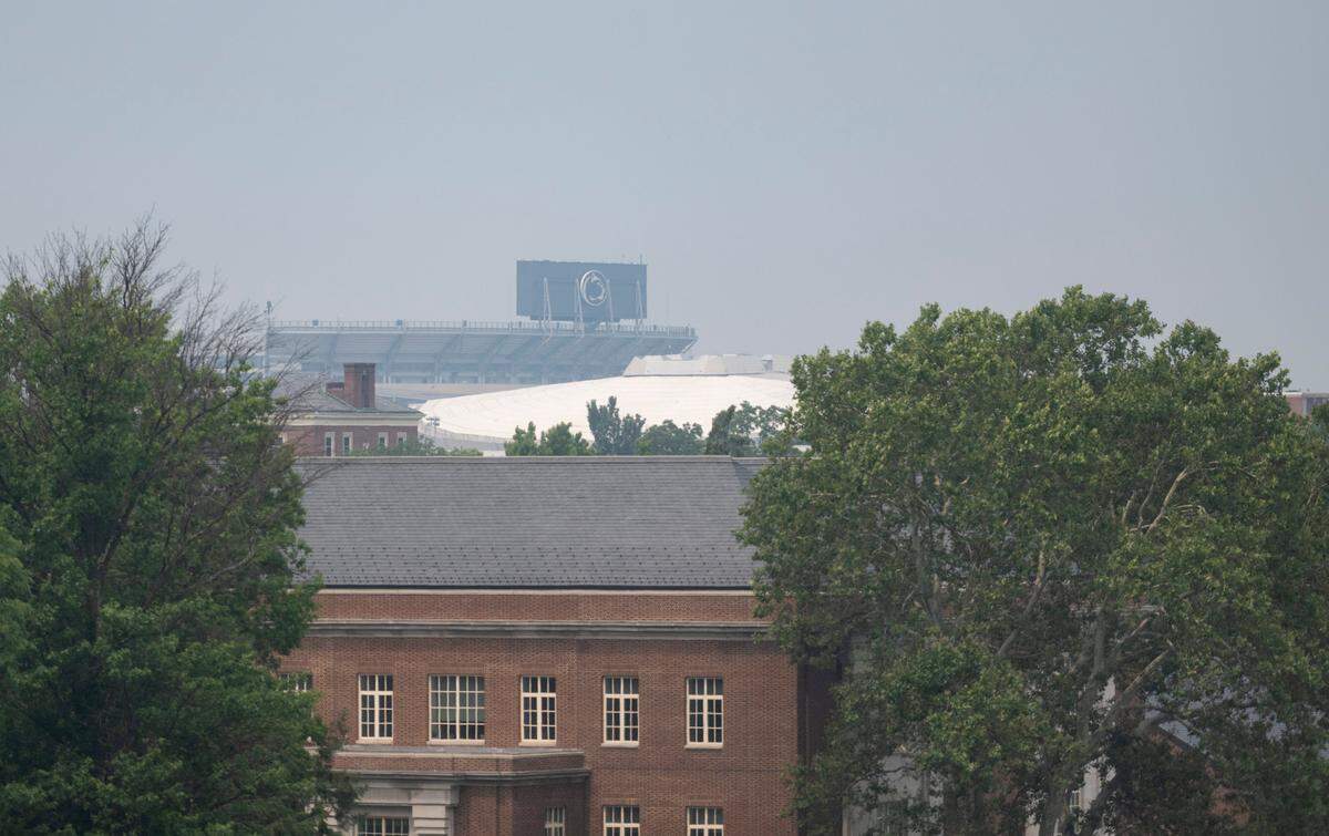 Beaver Stadium through the haze from the Fraser Street parking garage on Monday, July 17, 2023.