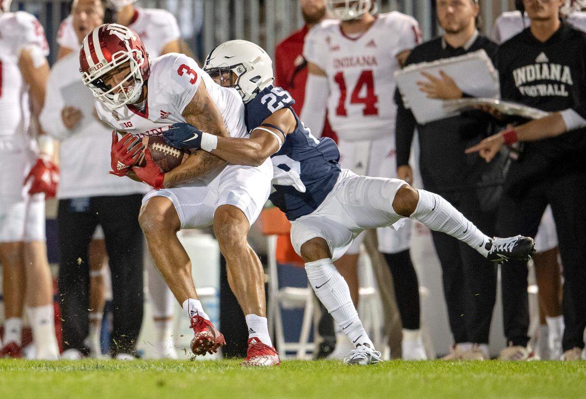 Penn State cornerback Daequan Hardy stops Indiana wide receiver Ty Fryfogle.