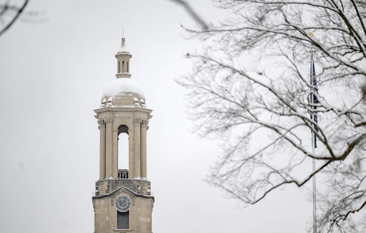 The bell tower of Old Main covered in snow on Tuesday, Dec. 2, 2025.