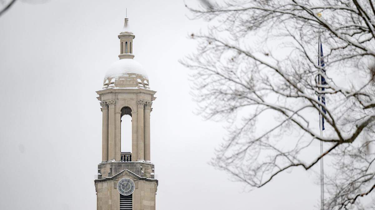 The bell tower of Old Main covered in snow on Tuesday, Dec. 2, 2025.