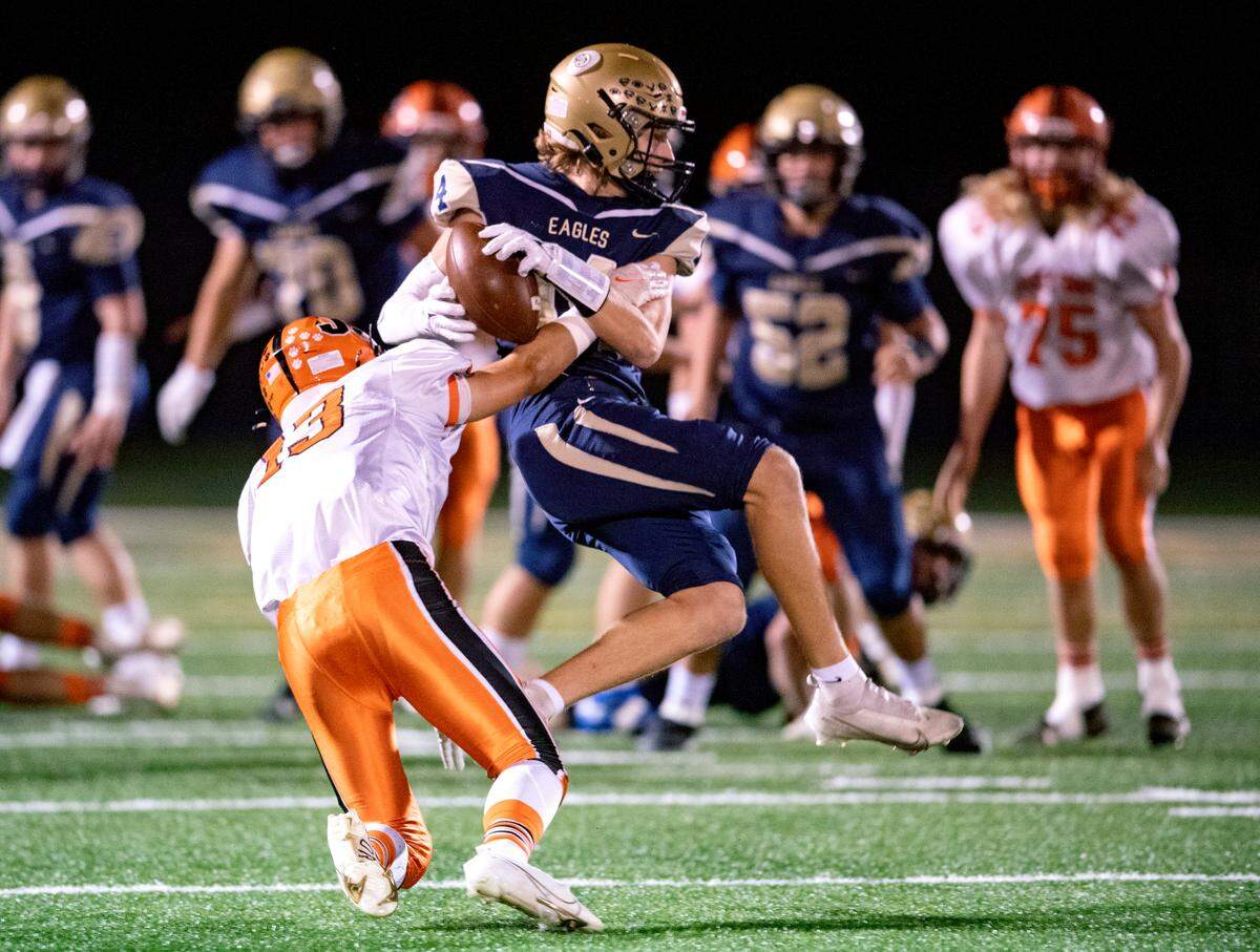 Jersey Shore’s Connor Griffin stops Bald Eagle Area’s Owen Irvin as he makes a catch during the game on Friday, Oct. 22, 2021.