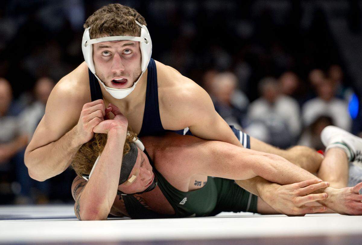 Penn State’s Mitchell Mesenbrink looks to the clock as he controls Michigan State’s Jay Nivison in the 165 lb bout of the match on Friday, Jan. 10, 2025 in Rec Hall. Mesenbrink won by tech fall.