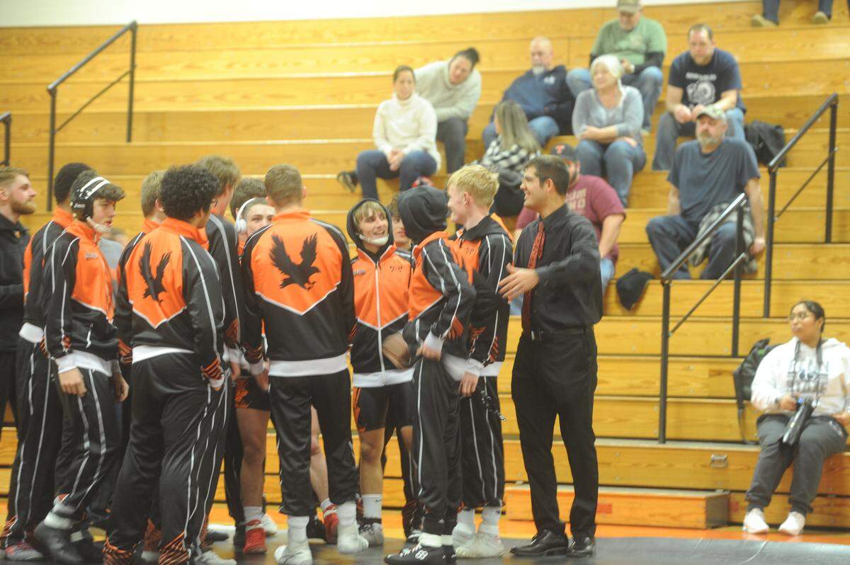 Tyrone coach Quentin Wright, right, gets his team ready for the start of its dual against Penns Valley on Tuesday. Wright, who wrestled at Penn State and Bald Eagle Area, led his team to a 39-31 win.