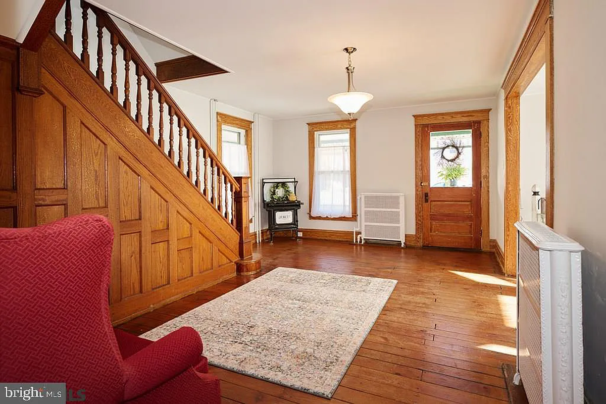 A view of the front foyer and hardwood staircase at 211 N. Pennsylvania Ave. Photo shared with permission from home’s listing agents, Linda and Ryan Lowe of RE/MAX Centre Realty.