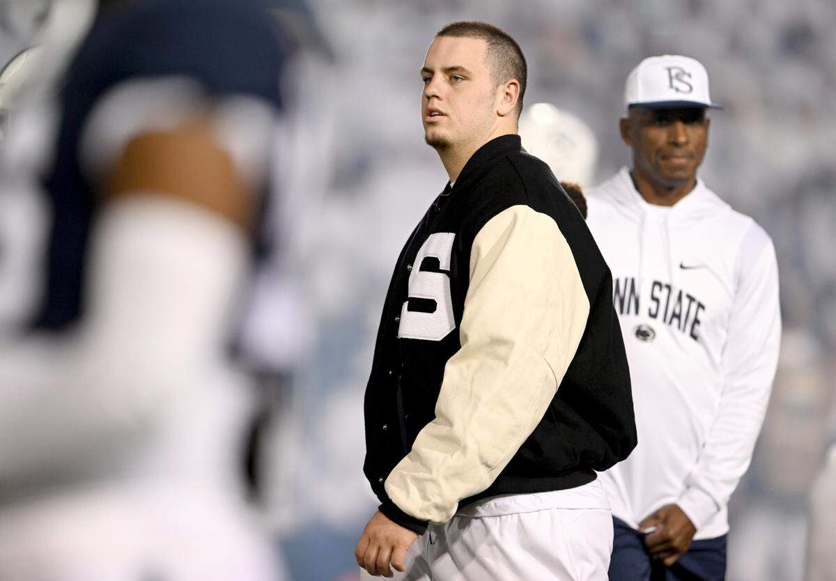 Penn State offensive lineman Landon Tengwall watches his teammates warm up before the game against Minnesota on Saturday, Oct. 22, 2022.