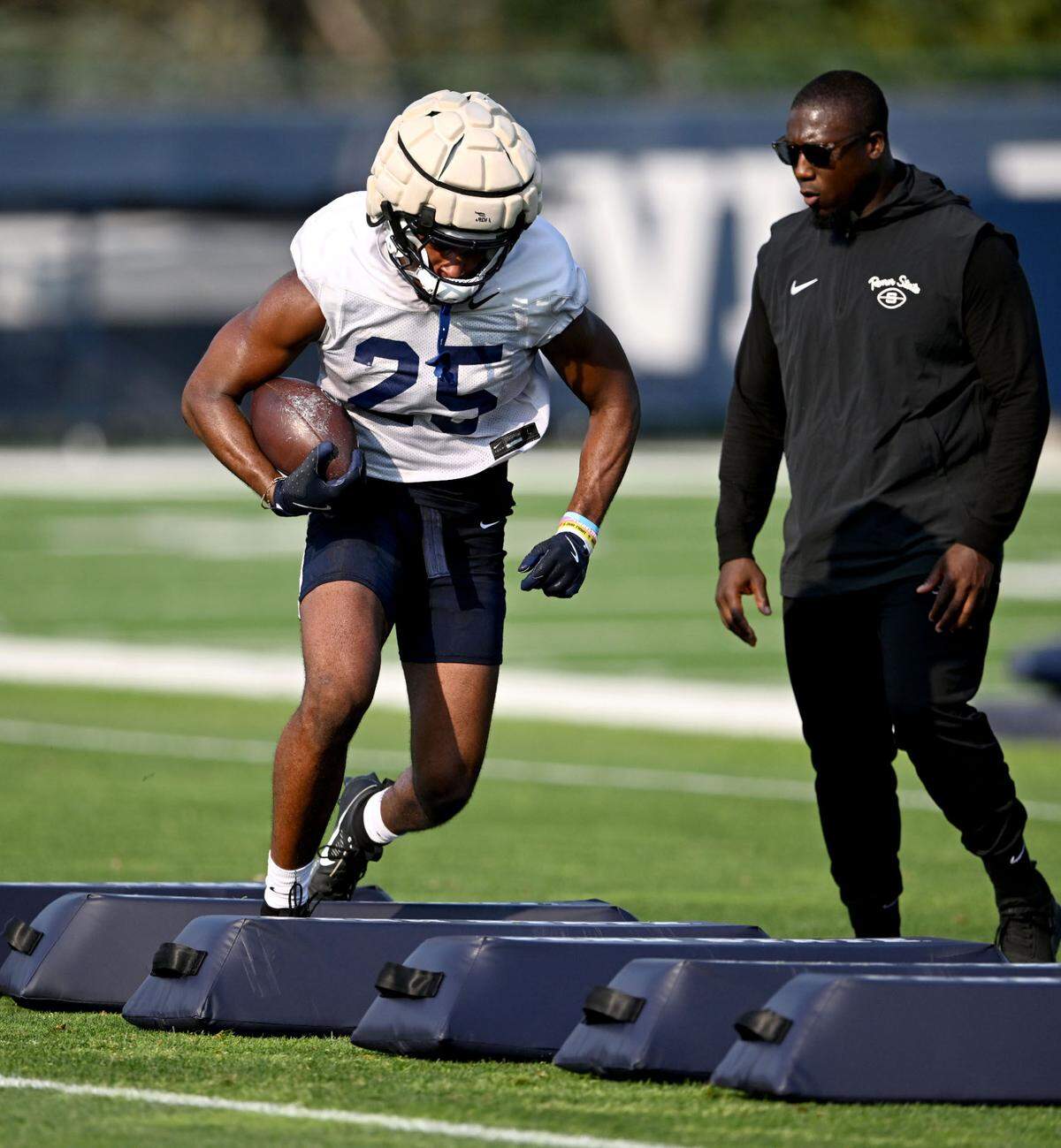 Penn State freshman running back Quinton Martin Jr. runs a drill at practice on Wednesday, July 31, 2024.