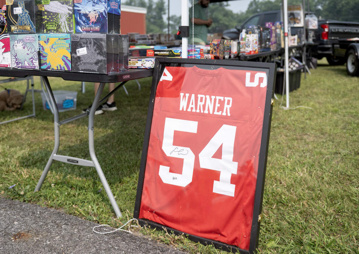A signed Fred Warner jersey for sale among the yard sales in Pine Glen during the 100 Mile Yard Sale on Friday, July 17, 2026.