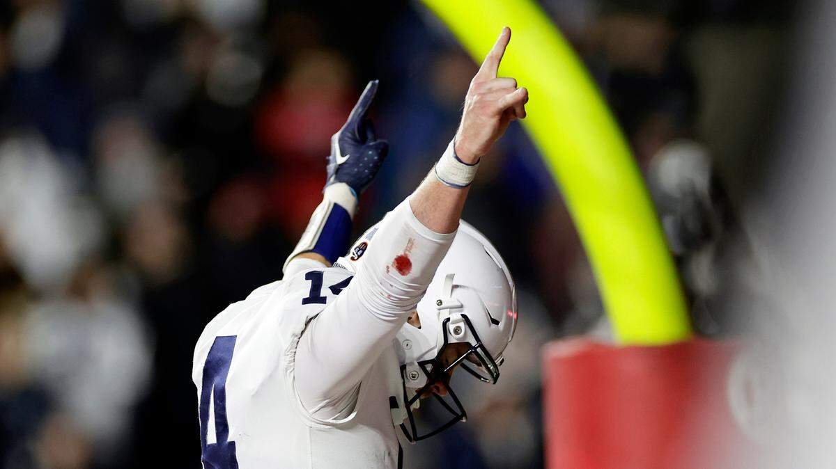 Penn State quarterback Sean Clifford celebrates after scoring a touchdown against Rutgers during the first half Saturday.