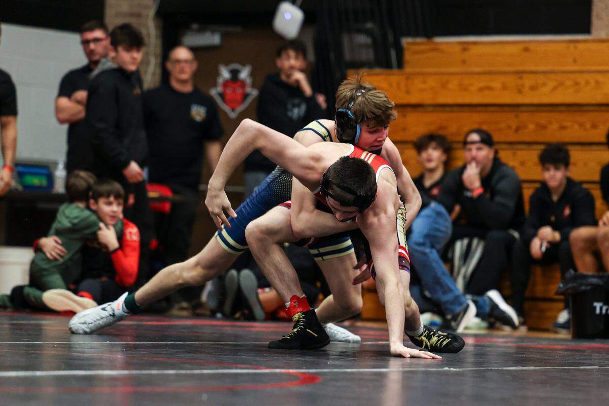 Bald Eagle Area’s Caden Judice controls Bishop McCort’s Jax Forrest in their 133-pound finals match of the Laurel Highlands Athletic Conference championships on Jan. 4, 2025 at Central Cambria High School in Ebensburg. Forrest topped Judice, 19-4, in 1:25.