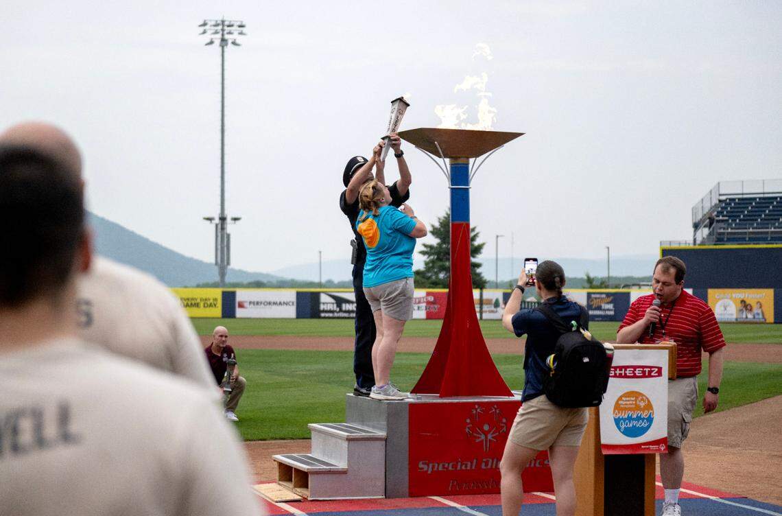 Three River Region athlete Nancy Grimm and Monroeville Police Department Officer Pierre DeFelice light the cauldron for the Special Olympics PA Summer Games on Thursday, June 5, 2025.