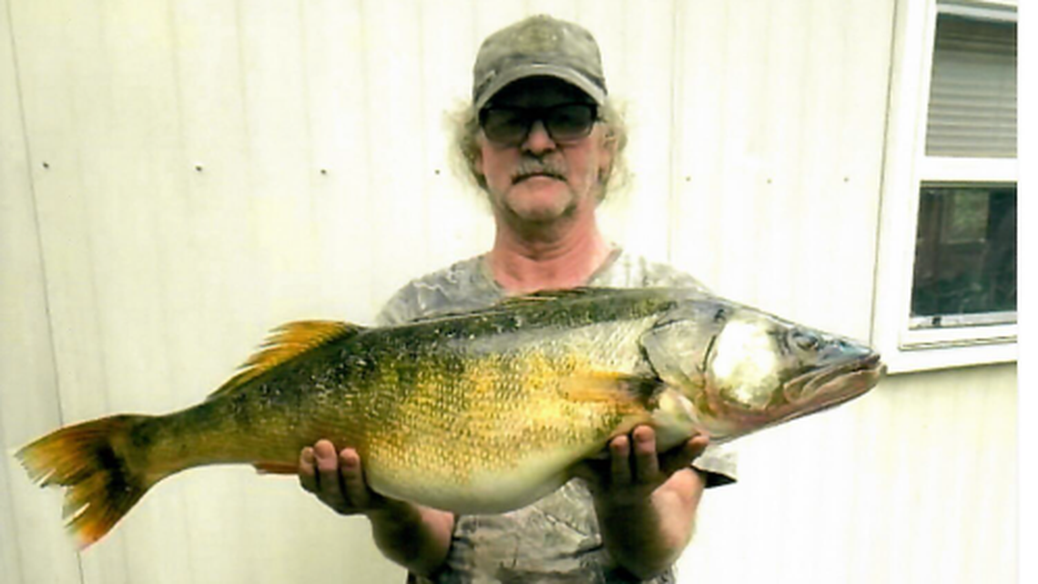 Richard Nicholson with his record-breaking walleye.