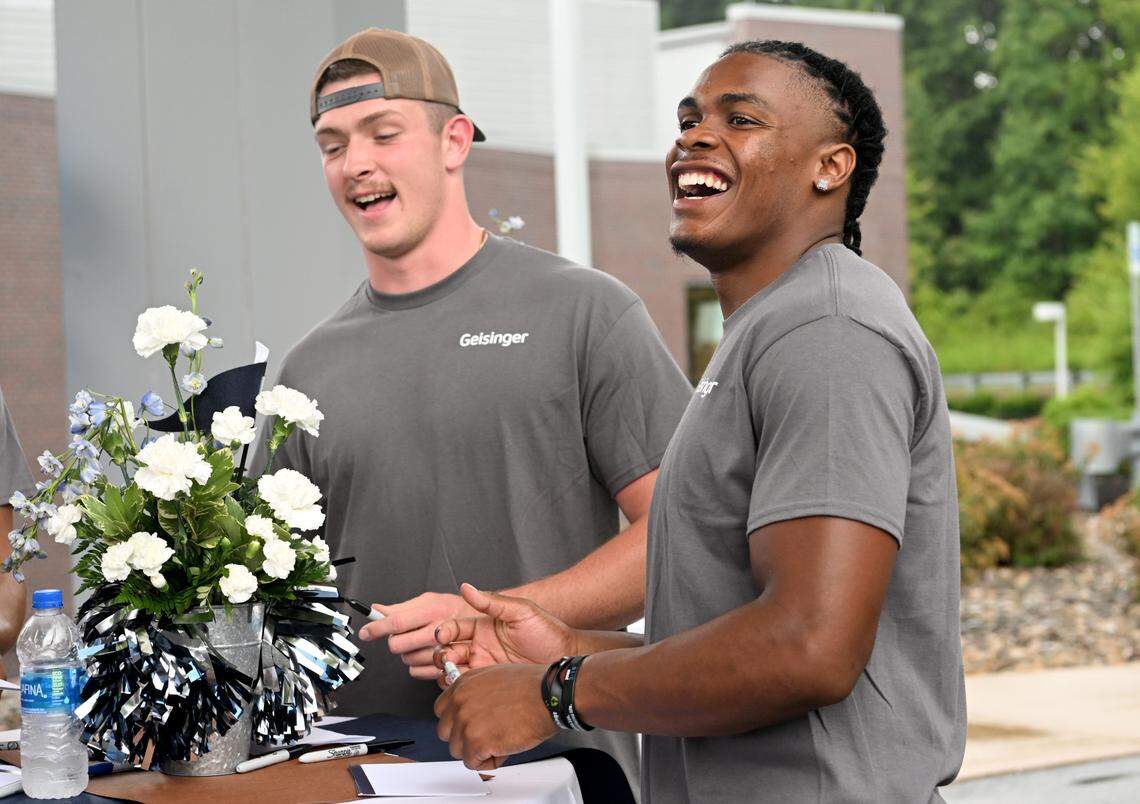 Penn State football player Ji’Ayir Brown laughs as he greets and sign autographs for Geisinger staff and patients outside of the Geisinger Healthplex State College on Thursday, July 28, 2022.