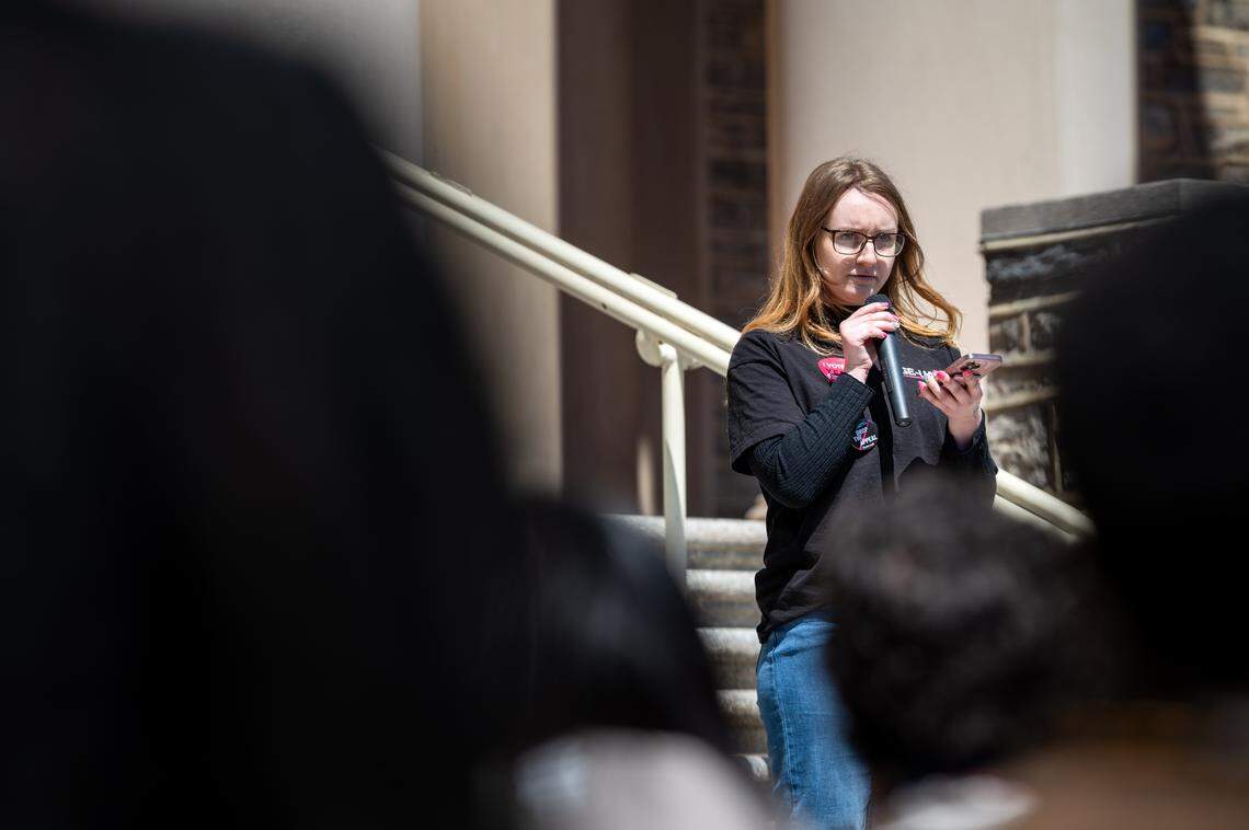 Kierstyn Higgins, a fourth year Ph.D. student studying ecology, speaks to the crowed during a rally in front of Old Main on Tuesday, April 21, 2026. 
