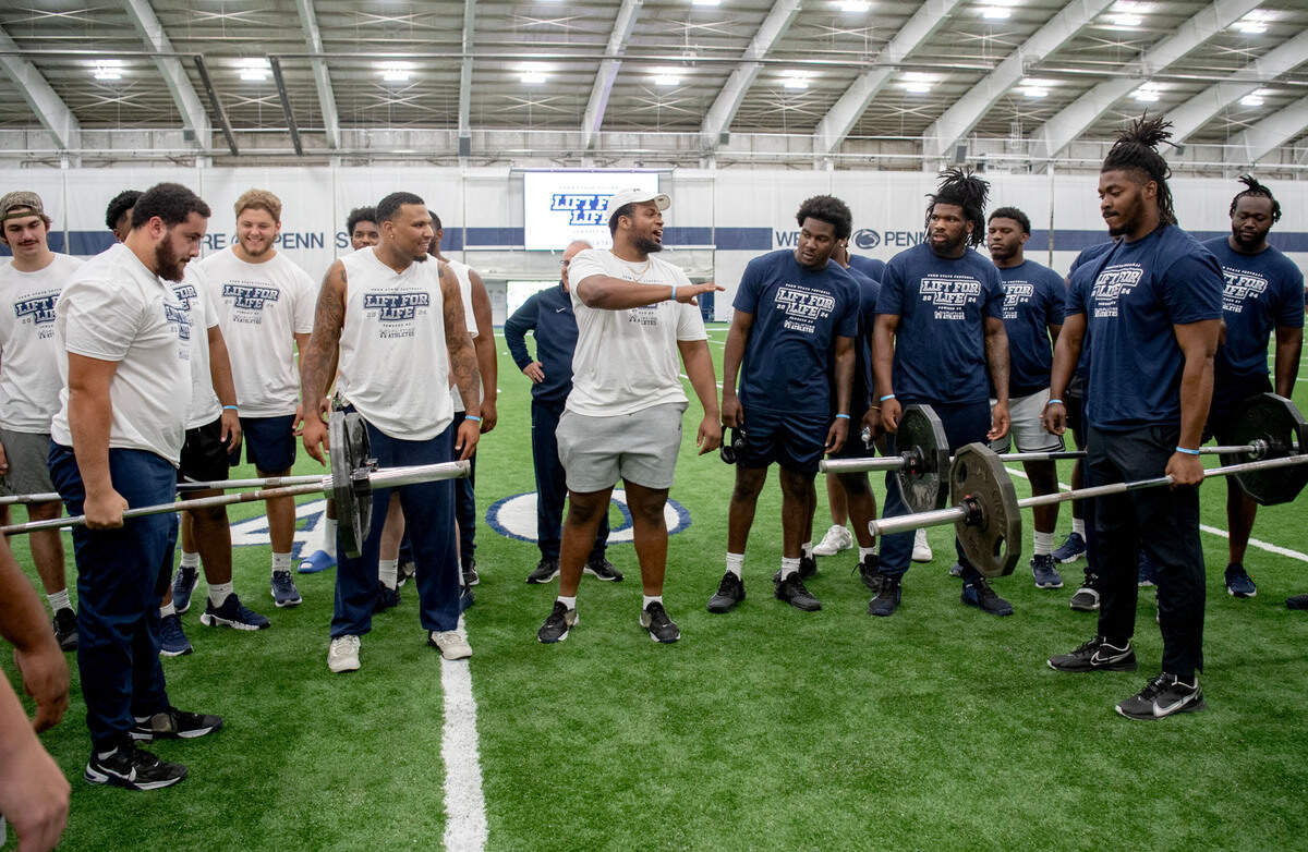 Offensive lineman Addison Penn and defensive end Amin Vanover face off in a farmers hold during Penn State football’s 21st Annual Lift for Life to benefit Uplifting Athletes on Thursday, June 13, 2024 in Holuba Hall.