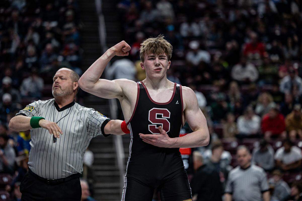 State College senior Asher Cunningham celebrates Saturday right after the Class 3A state title match, where he won by a 12-6 decision against Thomas Jefferson’s Bode Marlow at Hershey’s Giant Center. It was Cunnigham’s second straight individual state title.