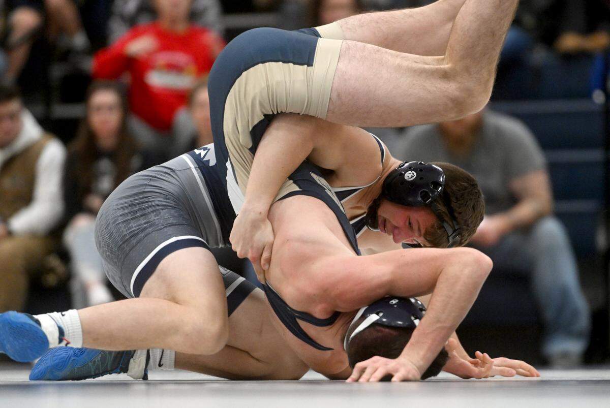 Philipsburg-Osceola’s Nate Fleck flips Bald Eagle Area’s Alex Survec in the 139 lb bout of the match on Wednesday, Dec. 21, 2022.