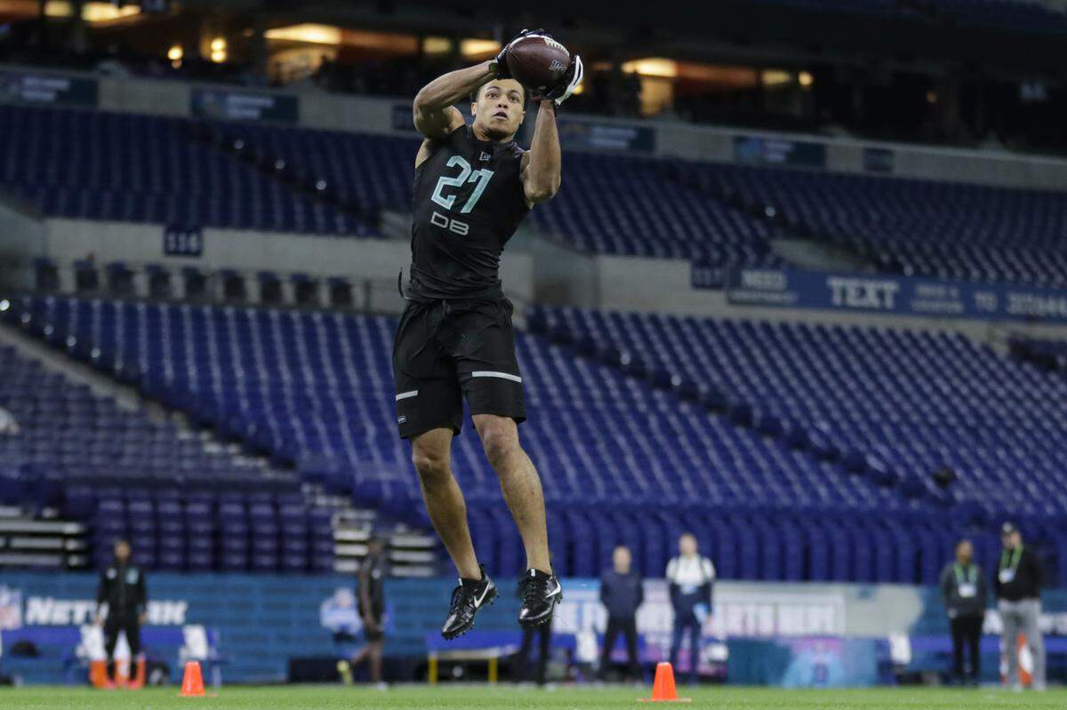 Penn State defensive back John Reid runs a drill at the NFL football scouting combine in Indianapolis, Sunday, March 1, 2020. (AP Photo/Michael Conroy)