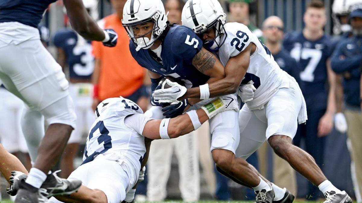 Wide receiver Omari Evans is stopped by cornerback Storm Duck during the Penn State Blue-White game on Saturday, April 15, 2023.