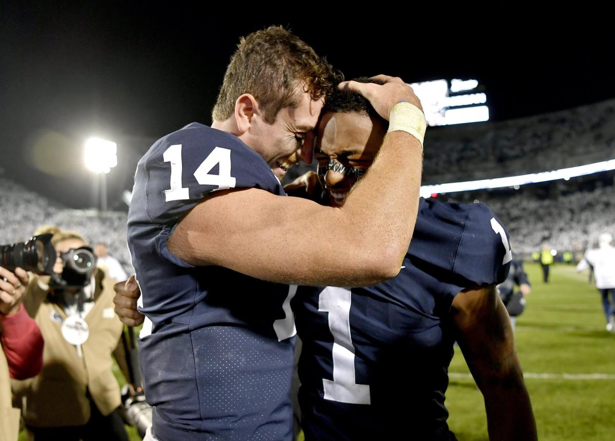 Penn State quarterback Sean Clifford and wide receiver KJ Hamler celebrate the 28-21 win over Michigan on Saturday, Oct. 19, 2019.