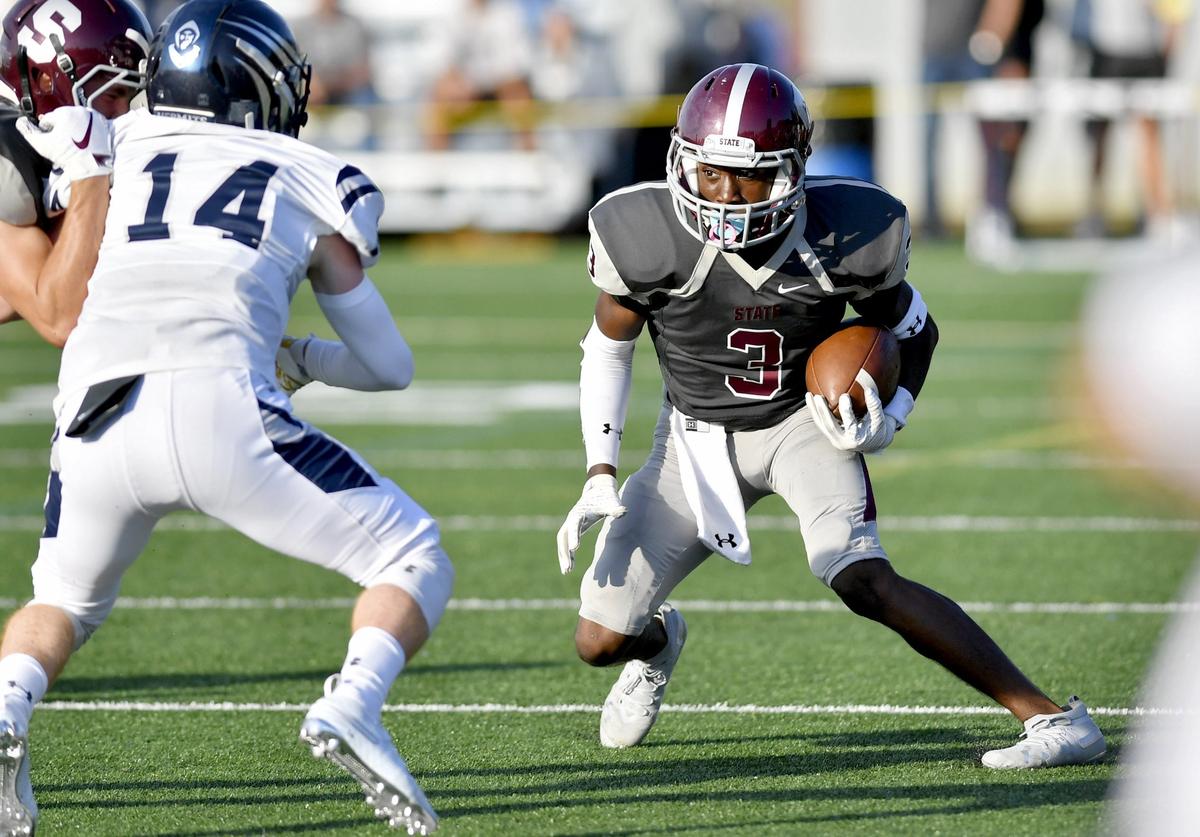 State College’s Lokey Howell cuts down the field with the ball during the game against St. Augustine on Friday, August 30, 2019 at the South Track Field.