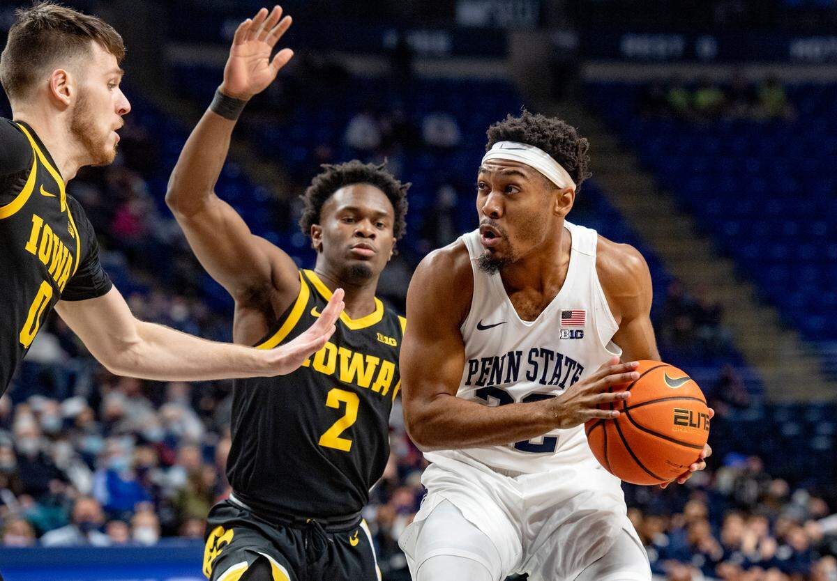 Penn State’s Jalen Pickett looks past Iowa defenders during the game on Jan. 31 at the Bryce Jordan Center.