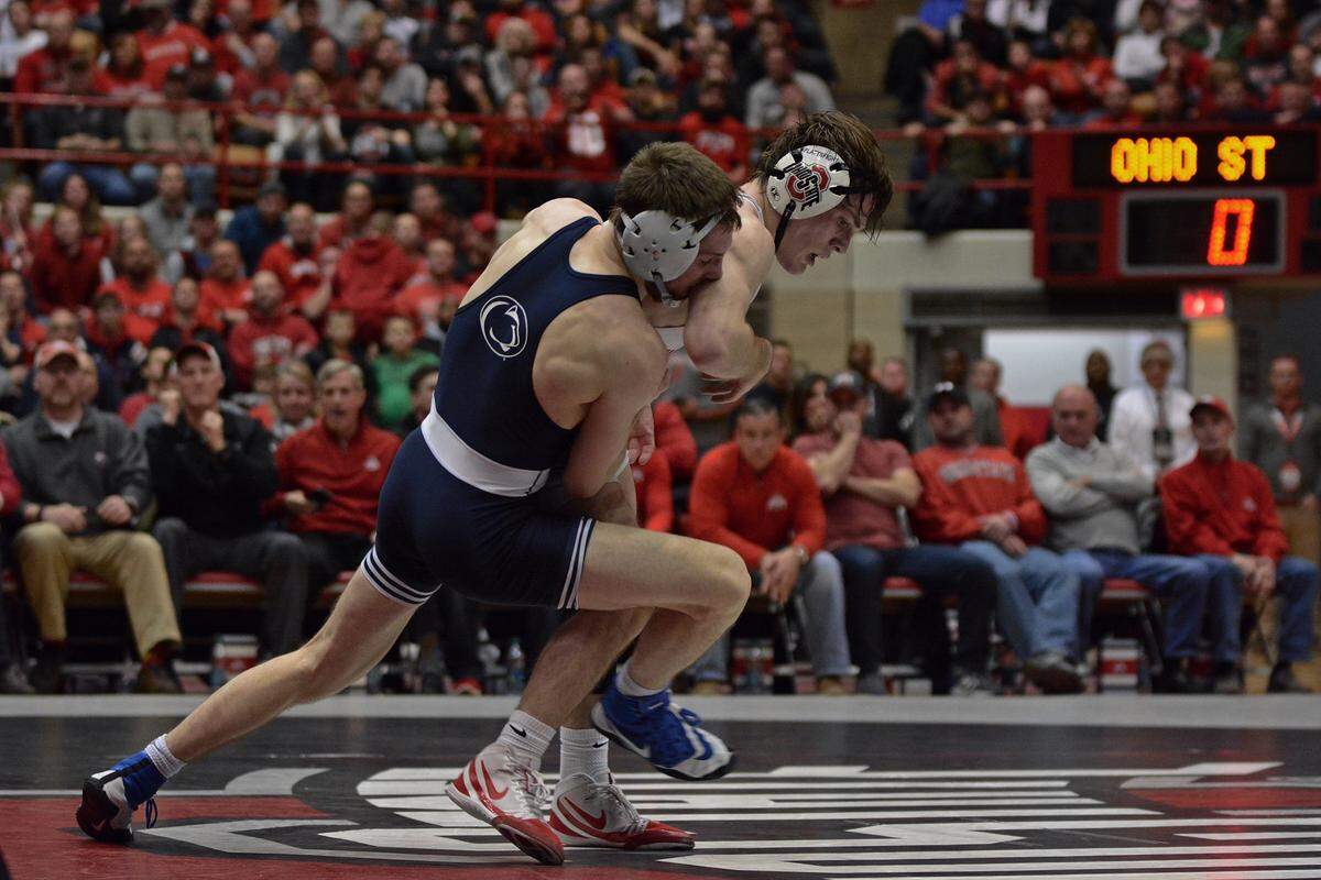 Penn State’s Nick Lee works to take down Ohio State’s Joey McKenna at 141 pounds Friday at St. John Arena in Columbus, Ohio.
