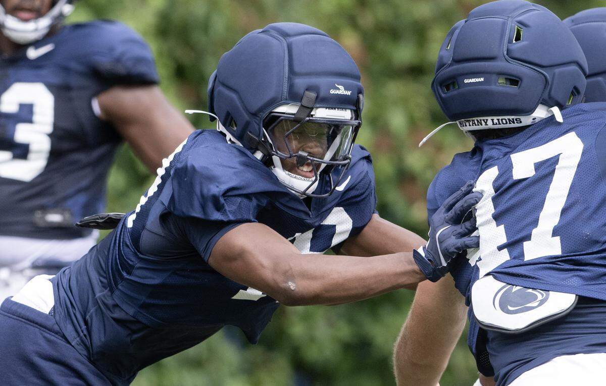 Penn State defensive end Chaz Coleman pushes into Aidan Probst during a drill at practice on Tuesday, Aug. 19, 2025.  