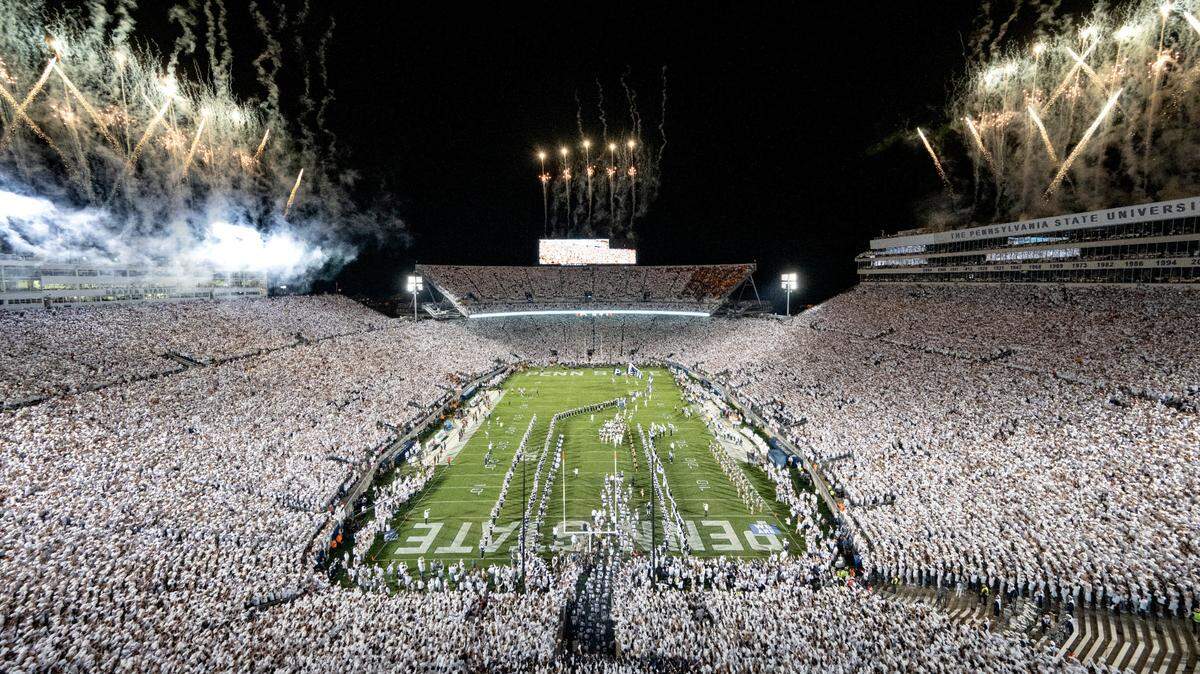 The Penn State football team runs onto the field for the White Out game against Minnesota on Saturday, Oct. 22, 2022 at Beaver Stadium.