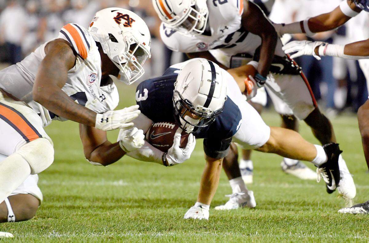Penn State wide receiver Parker Washington gets hit by Auburn’s Zakoby McClain during the game. McClain was called for targeting on the call.