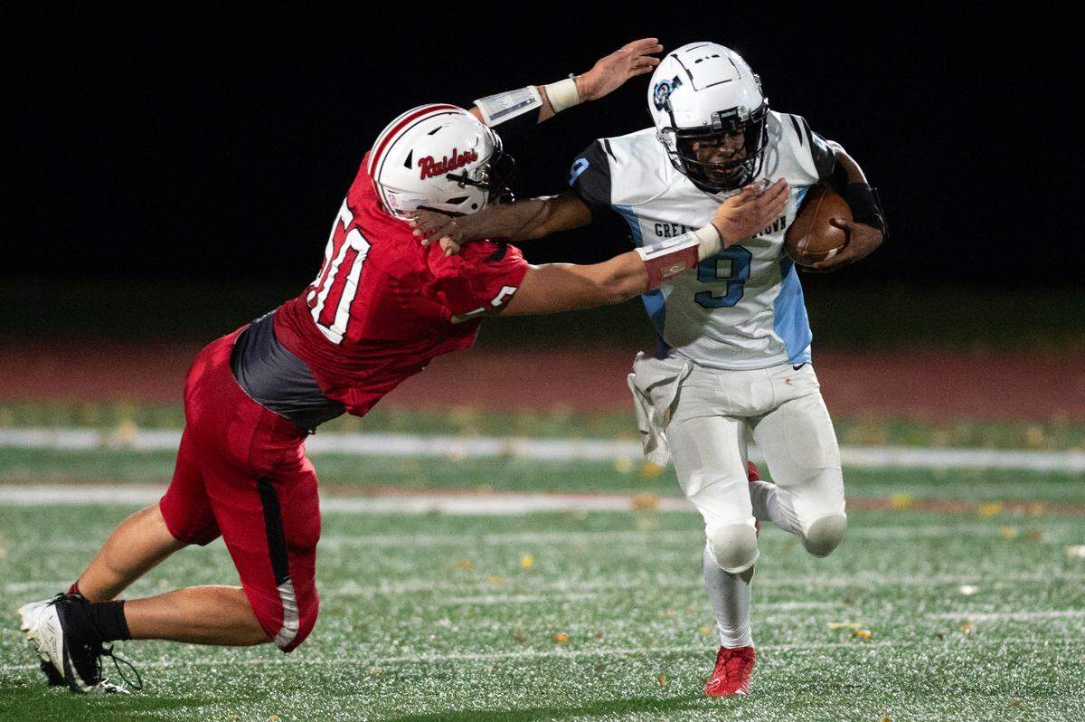 Johnstown quarterback Julius Reed attempts to stiff arm Bellefonte defensive end Logan Rarrick during a football game at Bellefonte High School on Friday, Nov. 1, 2024.