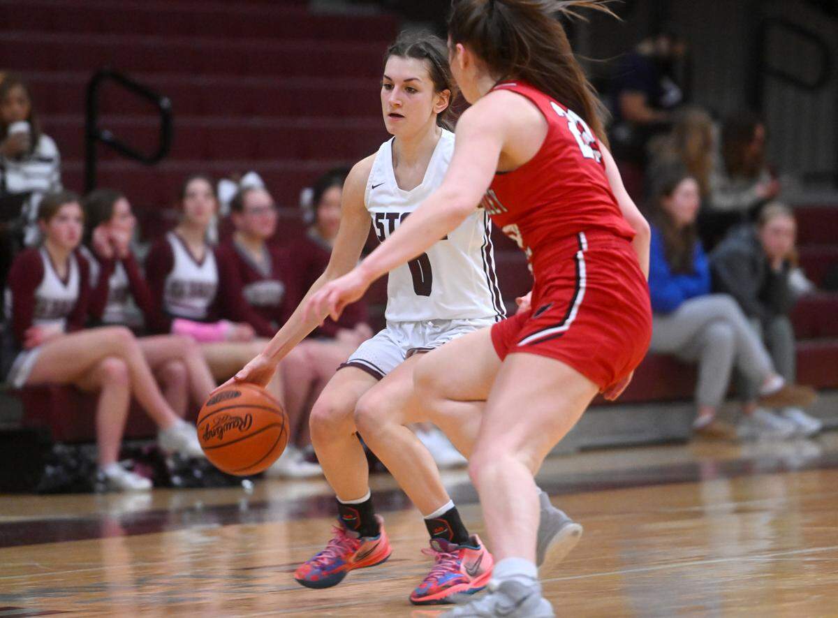 State College’s Diana Tsarnakova dribbles around a Cumberland Valley defender during the game on Tuesday, Jan, 24, 2023.