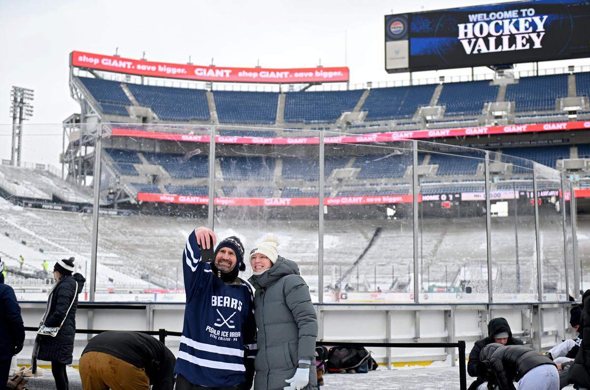 Mark Hayes and his daughter Lydia Owens pose for a selfie before the first public skate session on the ice rink at Beaver Stadium on Wednesday, Jan. 28, 2026.  