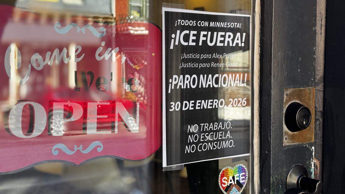 A sign on the door of Shaky Hands Coffee Shop in Bellefonte on Friday, Jan. 30, 2026, calls for solidarity with Minnesotans and justice for two Americans killed by federal agents in recent weeks.