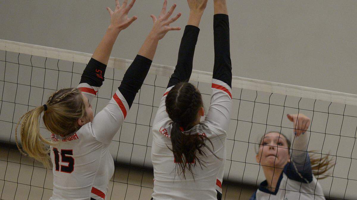 Philipsburg-Osceola’s Reese Hazelton hits past Central Cambria’s (15) Kate Kudlawiec and Mikalah Kim in the District 6 AA championship match Saturday, Nov. 11, 2021 at the Altoona Area Fieldhouse.