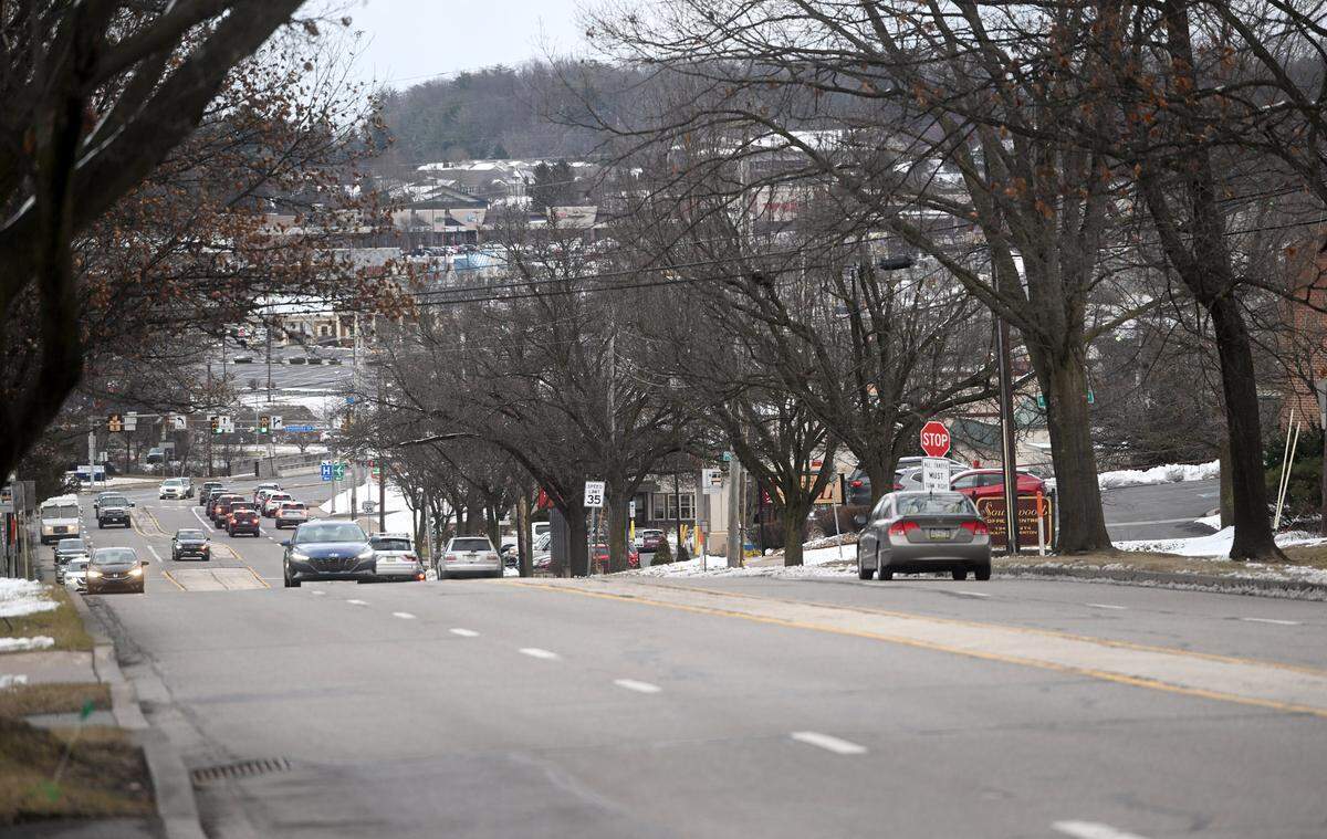 Traffic moves through the four lanes of South Atherton Street on Tuesday, Feb. 13, 2024.