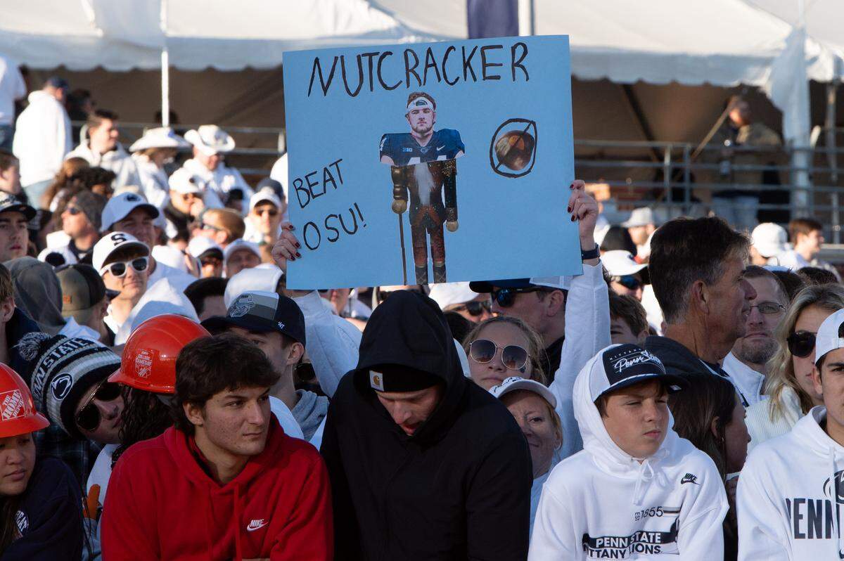 Penn State fans hold up signs on the set of ESPN College GameDay before the game against Ohio State at Beaver Stadium on Saturday, Nov. 2, 2024.