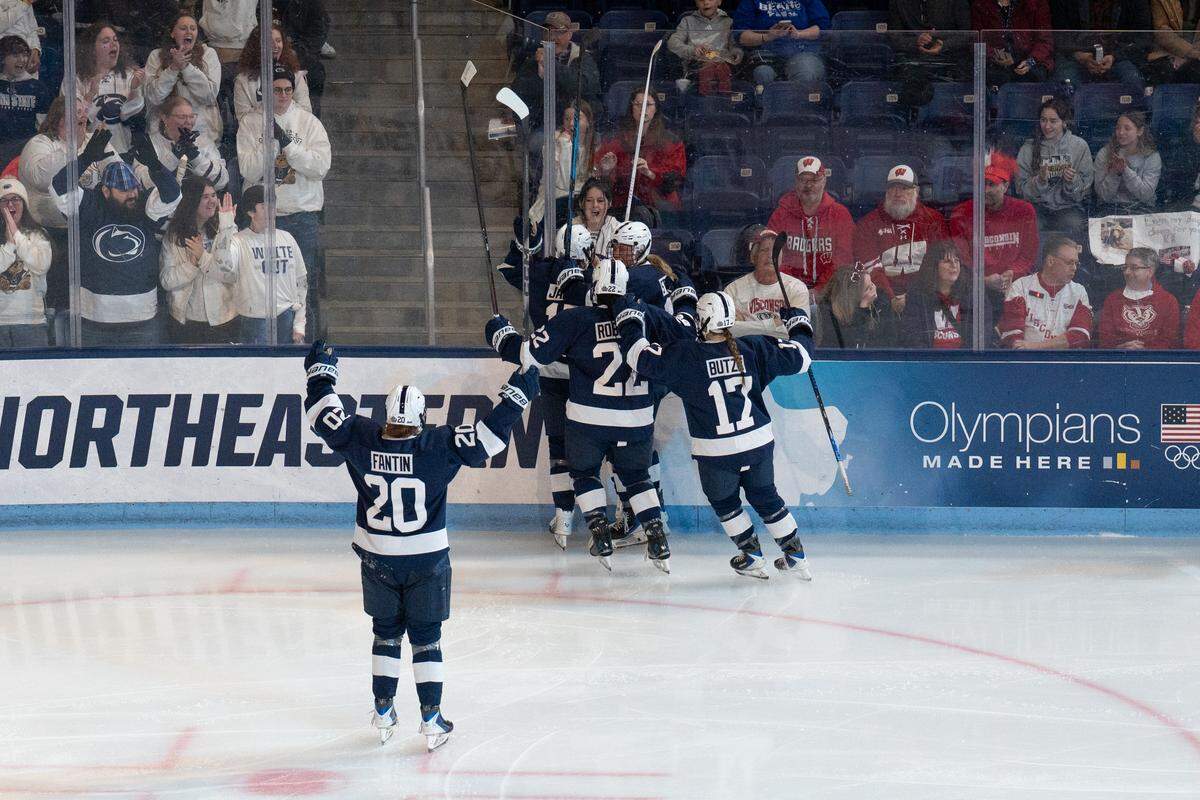 The Penn State women’s hockey team celebrates their first goal of the game during the women’s hockey Frozen Four game in Pegula Ice Arena on Friday, March 20, 2026. The Nittany Lions lost to the Badgers in overtime 4-3.