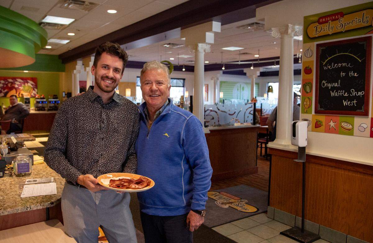 Roman Stefanovich and John Dimakopoulos in the Original Waffle Shop West on West College Avenue on Wednesday.
