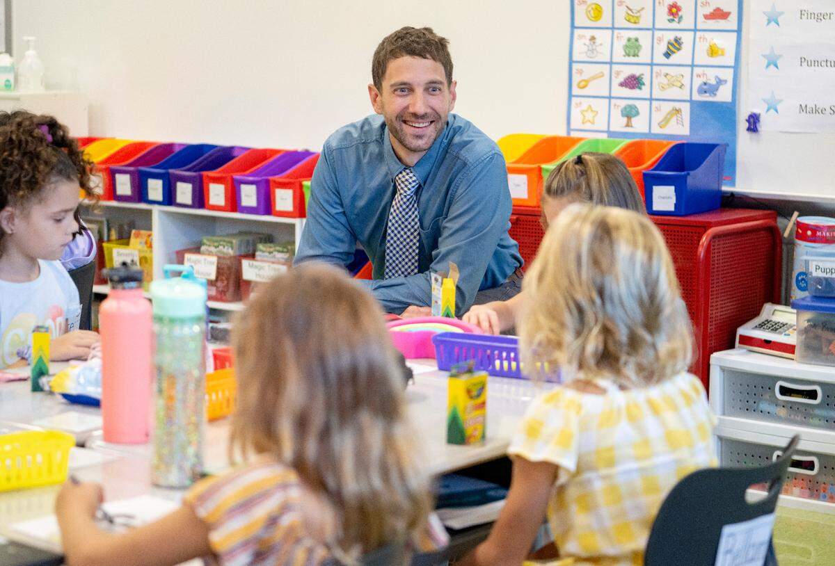 Spring Creek Elementary principal Paul Brigman introduces himself first graders during the first day of school on Tuesday, Aug. 23, 2022.