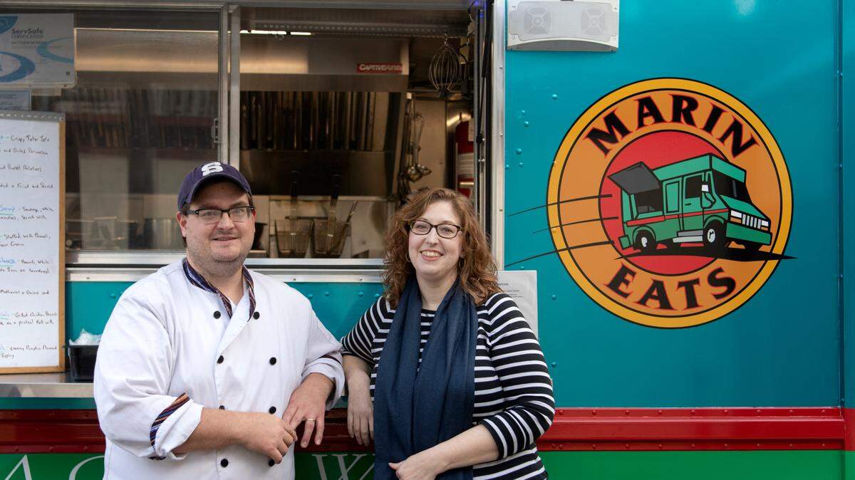 Matt and Erin McKean of Marin Eats food truck pose outside of Axemann Brewery on Thursday.