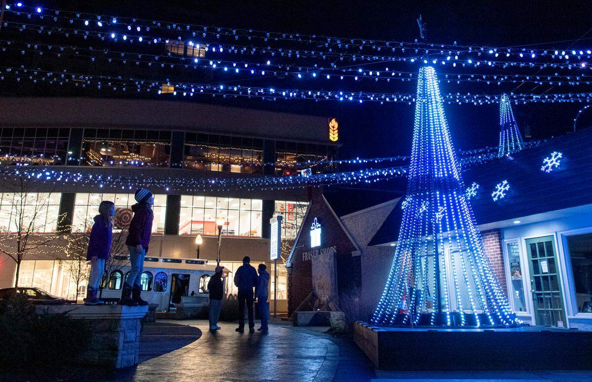 Youngsters watch the light display at the Dr. Martin Luther King Jr. Plaza State College on Friday, Dec. 4, 2020.