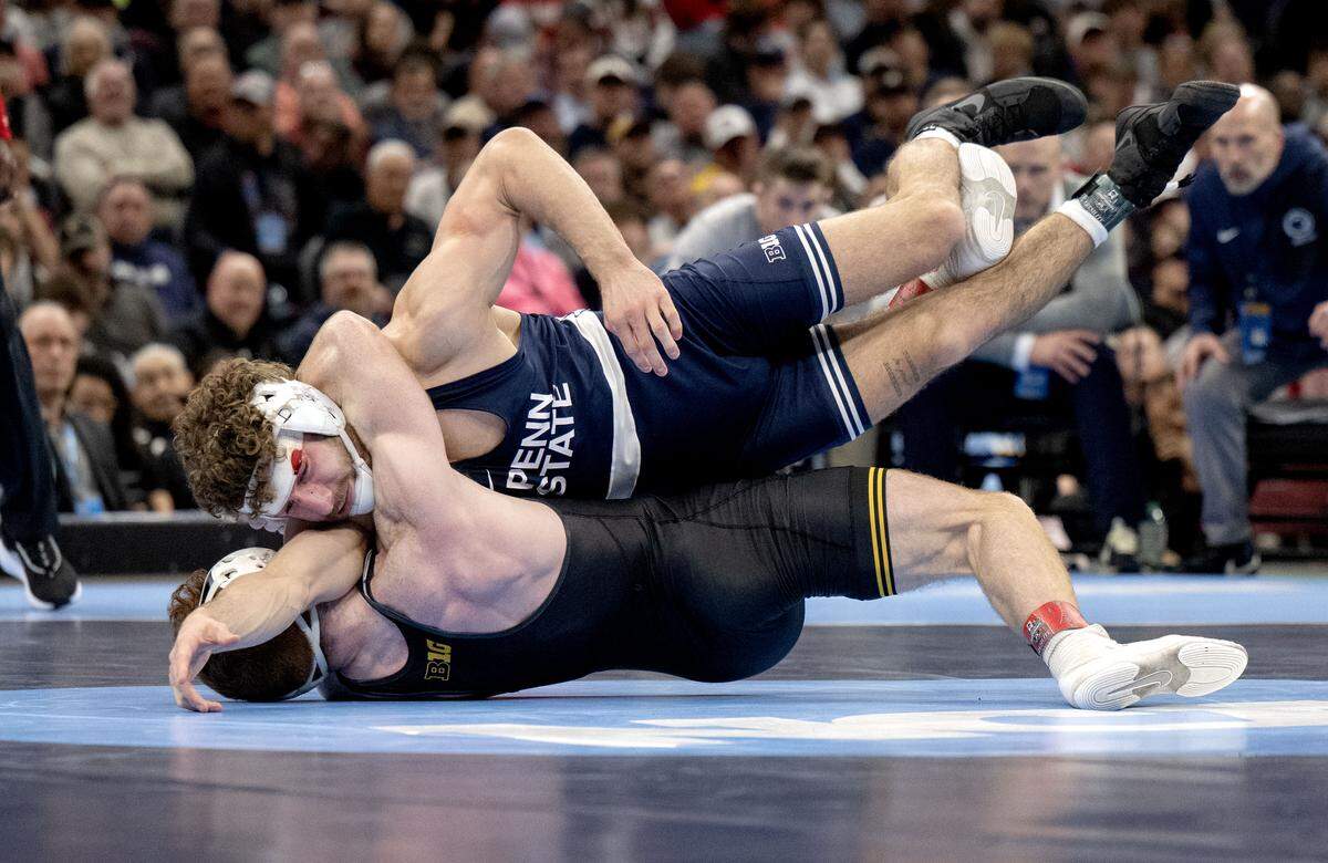 Penn State's Mitchell Mesenbrink controls Iowa’s Michael Caliendo in the 165-pound championship bout at the NCAA wrestling championships on Saturday, March 21, 2026.  