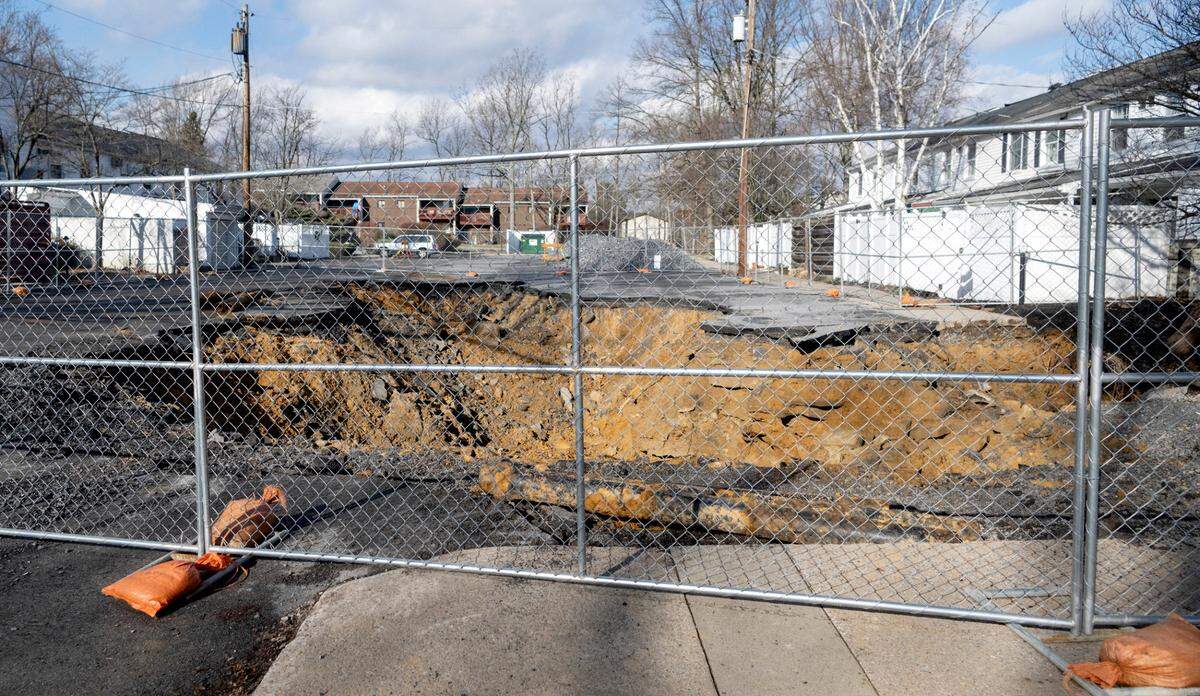 The sinkhole opened up in the parking lot for 18 townhomes between 432-466 Amblewood Way on Christmas Day.