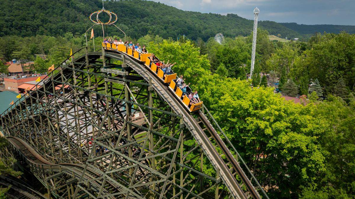 Riders on Knoebels’ Phoenix roller coaster begin their descent.