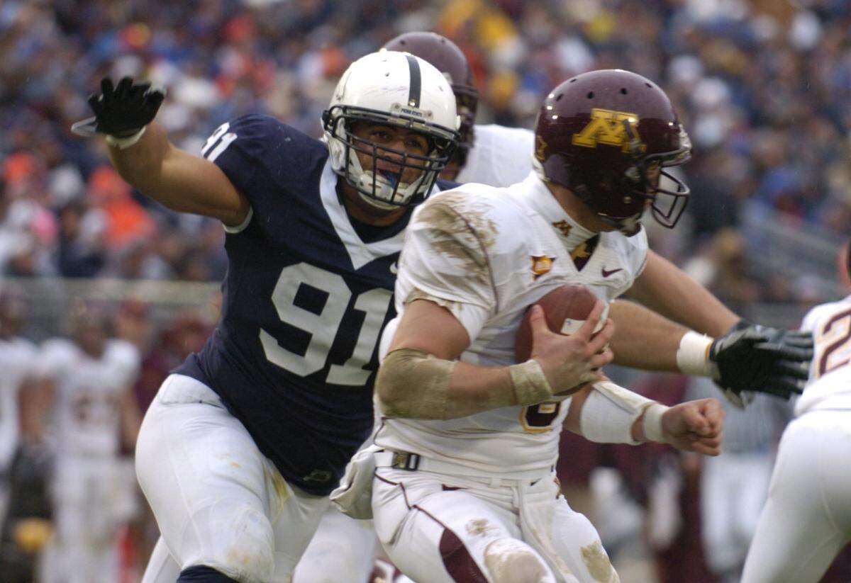 Jared Odrick rushes Adam Weber in the first half of Penn State’s game against Minnesota on Oct. 17, 2009.