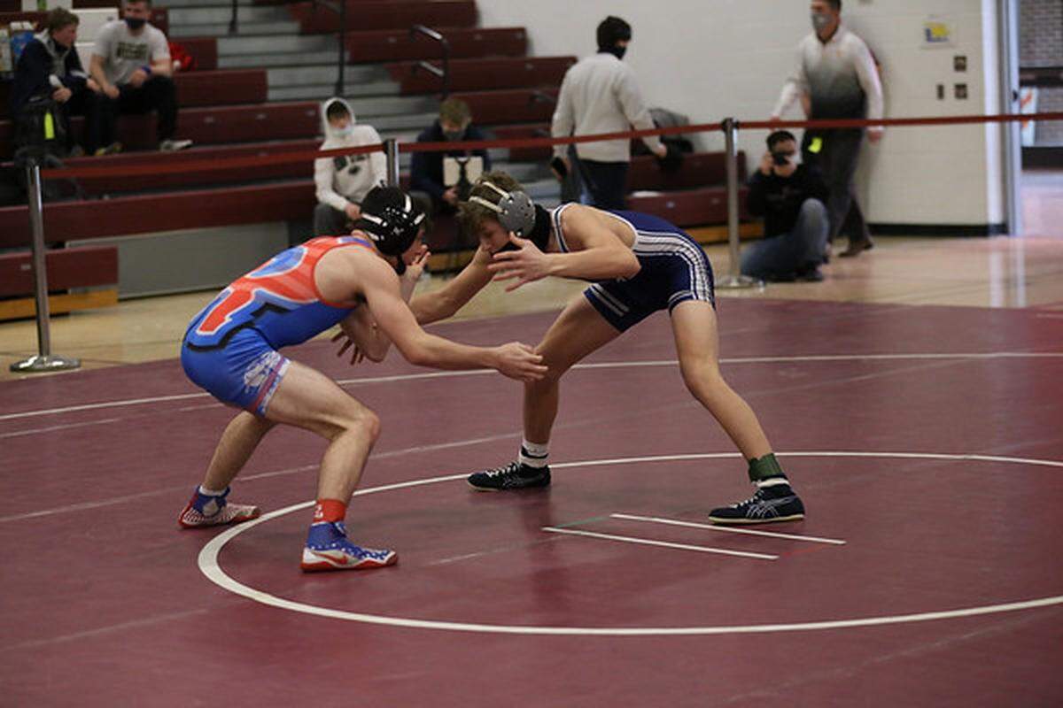 Penns Valley’s Ty Watson, right, looks for an opening on Richland’s Allen Mangus in their 132 lb consolation finals match on Saturday in the District 6 Class 2A Championships