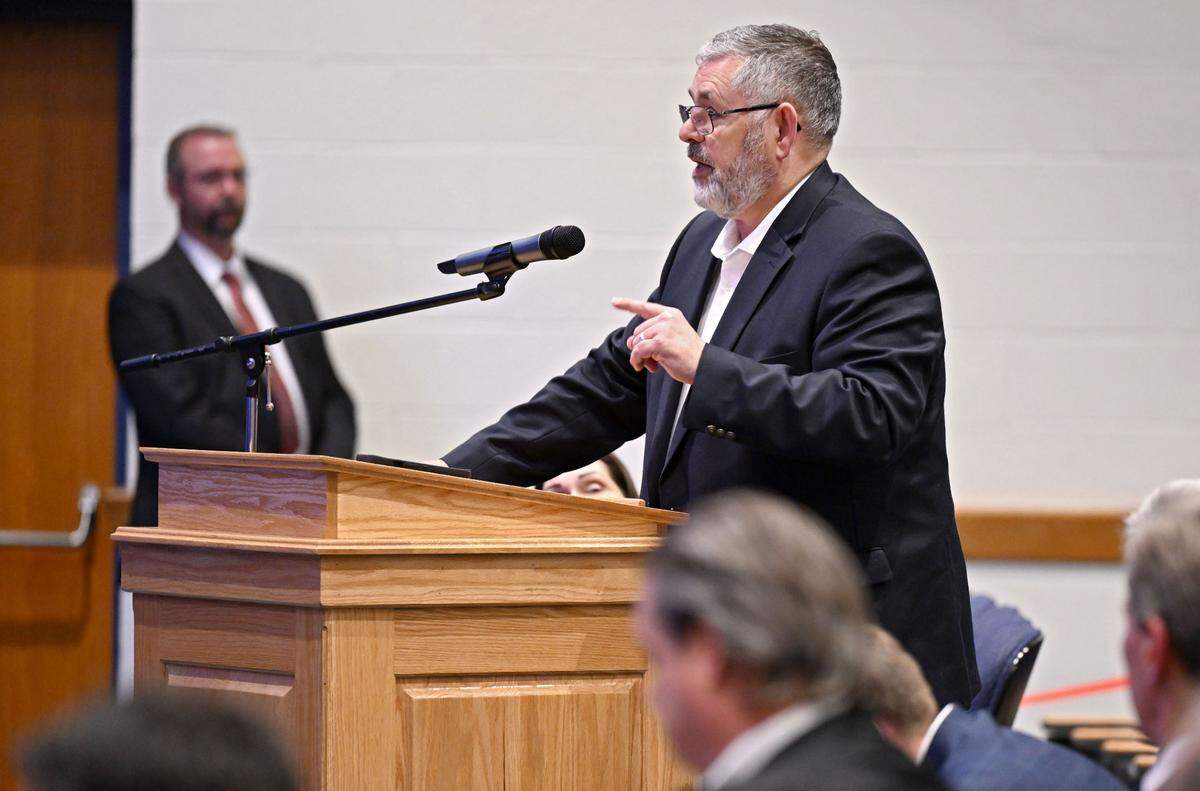 State Sen. Cris Dush, R-Brookville, speaks during the Pennsylvania Department of Corrections’ public hearing on the proposed closure of the facility on April 15, 2025 in auditorium of Bald Eagle Area High School/Middle School.