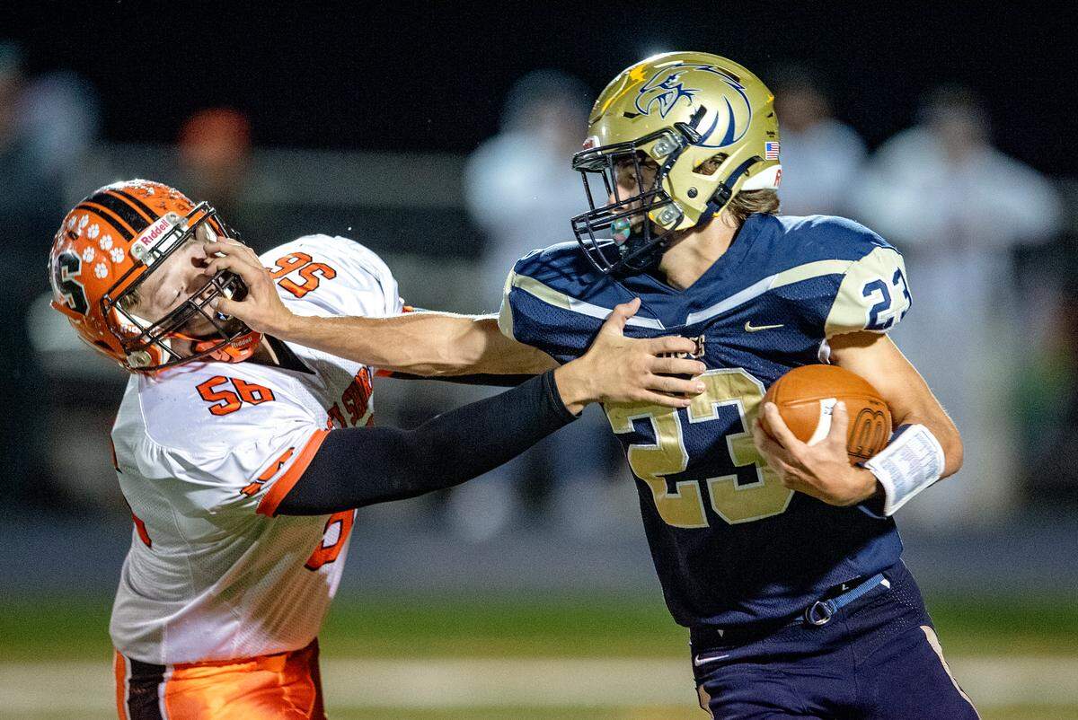 Bald Eagle Area’s Gavin Eckley pushes past a Jersey Shore defedner during the game on Friday, Oct. 22, 2021.