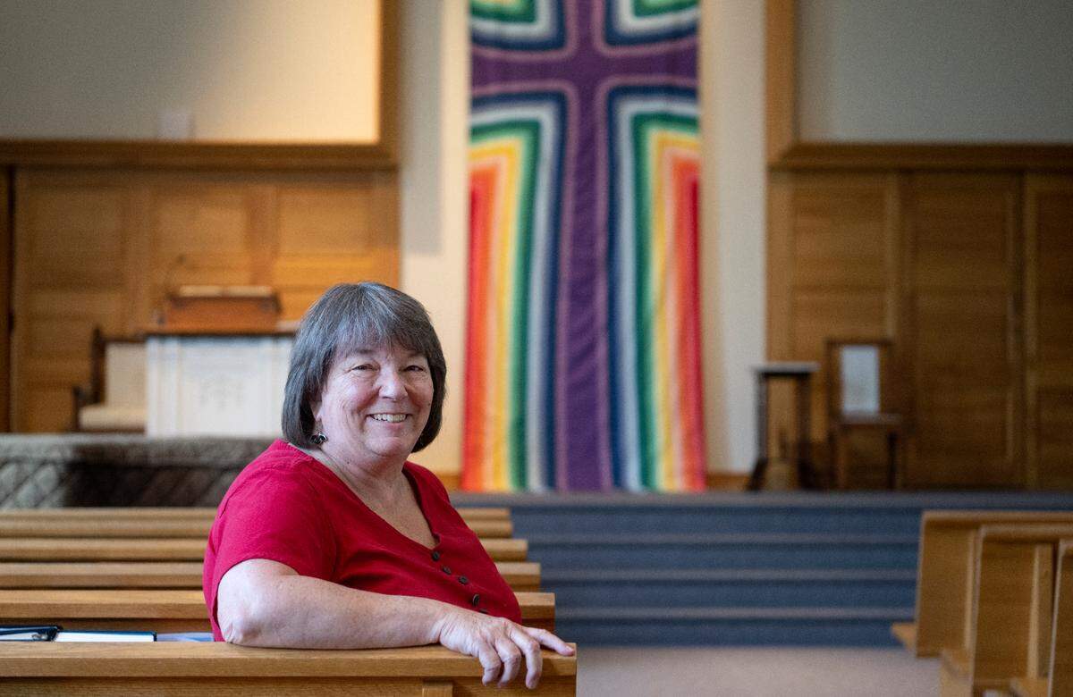 Pastor Bonnie Kline Smeltzer in the sanctuary of University Baptist & Brethren Church on Tuesday, July 19, 2022. The church is celebrating its 100th anniversary this year.