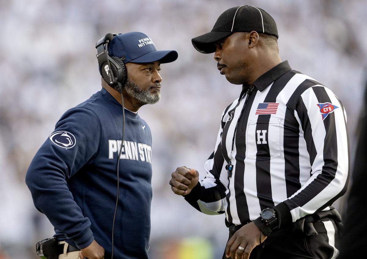 Penn State interim coach Terry Smith talks to the referee about Indiana’s touchdown during the game on Saturday, Nov. 8, 2025.